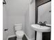 Modern bathroom with updated sink, mirror and a toilet at 1923 Osman Ave, Orlando, FL 32806
