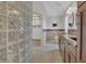 Elegant bathroom featuring a glass block partition and vanity with granite countertop at 1923 Osman Ave, Orlando, FL 32806
