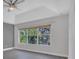 Bedroom with large windows overlooking the garden and a trey ceiling at 1923 Osman Ave, Orlando, FL 32806