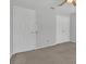 Neutral bedroom with carpeted floor and two doors to access other parts of the home at 1923 Osman Ave, Orlando, FL 32806