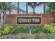 Ashbury Park community brick sign with a black and gold sign, surrounded by decorative plants at 1923 Osman Ave, Orlando, FL 32806