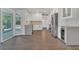 Bright kitchen with gray wood floors, white cabinets, stainless steel appliances, and lots of counter space at 1923 Osman Ave, Orlando, FL 32806