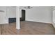 Open living room with hardwood flooring and large windows for natural light at 1923 Osman Ave, Orlando, FL 32806