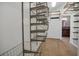 Spacious walk-in closet with custom wire shelving and ample storage space at 1923 Osman Ave, Orlando, FL 32806