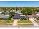 Aerial view of a well-maintained home with mature trees and manicured landscaping at 1925 Poinsetta Ln, Maitland, FL 32751