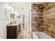 Bathroom featuring a shower, bath, and double vanity with granite countertops at 1925 Poinsetta Ln, Maitland, FL 32751