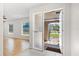 Bright foyer with tile floors, leading to a home with laminated wood floors at 1925 Poinsetta Ln, Maitland, FL 32751