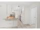 Kitchen featuring granite countertops, tiled floors, and ample storage space in white cabinets at 1925 Poinsetta Ln, Maitland, FL 32751