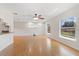 Bright open living room featuring laminate flooring and many windows for natural light at 1925 Poinsetta Ln, Maitland, FL 32751