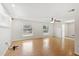 Open living space featuring laminated wood floors, bright light, and a ceiling fan at 1925 Poinsetta Ln, Maitland, FL 32751