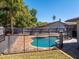 View of private backyard pool with patio and wooden fence at 1925 Poinsetta Ln, Maitland, FL 32751