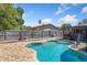 Backyard pool featuring a brick patio, -safe fence and wooden fence at 1925 Poinsetta Ln, Maitland, FL 32751