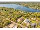 Aerial view showcasing the property's expansive lot and proximity to a large lake at 1984 Windermere Rd, Windermere, FL 34786