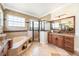 Beautiful bathroom with a soaking tub, a glass shower, dual vanities, and tile flooring at 1984 Windermere Rd, Windermere, FL 34786