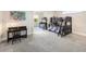 Bedroom with two bunk beds, desk, light grey carpet, and light neutral walls at 1984 Windermere Rd, Windermere, FL 34786