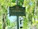 Windermere Business District sign framed by lush greenery and Spanish moss, showcasing charm at 1984 Windermere Rd, Windermere, FL 34786
