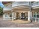 Detailed view of front entrance with stately columns and wrought iron detailing on balconies at 1984 Windermere Rd, Windermere, FL 34786