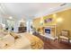 Bright main bedroom with fireplace, wood floors, and balcony access for a luxurious retreat at 1984 Windermere Rd, Windermere, FL 34786