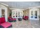 An outdoor covered patio with comfortable seating and stylish decor at 1984 Windermere Rd, Windermere, FL 34786