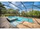 A screened-in pool with an attached spa features a brick paver deck at 1984 Windermere Rd, Windermere, FL 34786