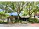Charming street view of shops framed by lush trees and a brick-paved road at 1984 Windermere Rd, Windermere, FL 34786
