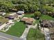 Aerial shot capturing this property with a long driveway and a well-manicured front lawn at 2010 Overlook Dr, Winter Haven, FL 33884