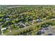 Aerial view of the neighborhood showcasing a mix of residential homes and natural wooded areas at 2010 Overlook Dr, Winter Haven, FL 33884