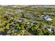 Neighborhood aerial showcasing homes, lush greenery, and community amenities in a scenic setting at 2010 Overlook Dr, Winter Haven, FL 33884