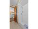 Bathroom shower with white tiled walls and a partial view of the bedroom at 2010 Overlook Dr, Winter Haven, FL 33884