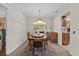 Dining room with carpet and a hanging light fixture at 2010 Overlook Dr, Winter Haven, FL 33884