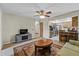 Comfortable living room featuring a ceiling fan and a view of the kitchen area at 2010 Overlook Dr, Winter Haven, FL 33884