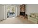 Cozy living room featuring a stone fireplace, sliding glass doors, and comfortable seating at 2010 Overlook Dr, Winter Haven, FL 33884