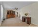 Spacious living room with a ceiling fan and classic-style wooden furniture at 2010 Overlook Dr, Winter Haven, FL 33884