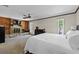 Main bedroom with a stone fireplace, wood paneling, and bright, natural light at 2010 Overlook Dr, Winter Haven, FL 33884