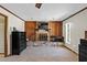 Main bedroom with a stone fireplace, wood paneling, and dark wood dresser at 2010 Overlook Dr, Winter Haven, FL 33884