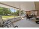 Relaxing screened porch with outdoor dining, perfect for enjoying serene backyard views at 2010 Overlook Dr, Winter Haven, FL 33884