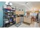 Spacious kitchen featuring a stainless steel dishwasher, sink, and ample storage, with an adjacent dining area at 2242 Dancy Trl, Clermont, FL 34714