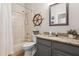 Bathroom featuring a shower and tub, granite vanity, and nautical decor at 2315 Cypress Trace Cir, Orlando, FL 32825