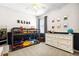 Bright bedroom featuring a bunk bed, white dresser, and superhero themed decor at 2315 Cypress Trace Cir, Orlando, FL 32825