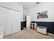 Bedroom with closet, shelving and play chest with wainscoting detail at 2315 Cypress Trace Cir, Orlando, FL 32825