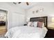 Bright bedroom with ceiling fan, closet, and bedside tables at 2315 Cypress Trace Cir, Orlando, FL 32825