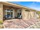 Covered patio with brick flooring, outdoor seating, and easy access to a fenced yard at 2315 Cypress Trace Cir, Orlando, FL 32825