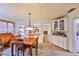 Dining room with built-in shelving and access to living room with fireplace at 2381 Roxbury Rd, Winter Park, FL 32789