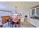 Dining room with built-in shelving and access to living room at 2381 Roxbury Rd, Winter Park, FL 32789