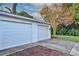 This detached two-car garage features white doors and plenty of parking space for vehicles and storage at 2381 Roxbury Rd, Winter Park, FL 32789