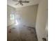 Modest bedroom featuring neutral walls, a ceiling fan, and natural light from a window at 2625 Queen Mary Pl, Maitland, FL 32751