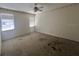 Empty bedroom featuring a ceiling fan and two windows at 2625 Queen Mary Pl, Maitland, FL 32751