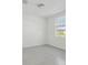 Bright bedroom features neutral paint, tile floors, natural light and views at 312 Castle Dr, Lake Alfred, FL 33850