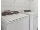 Laundry room features a new washer and dryer at 312 Castle Dr, Lake Alfred, FL 33850