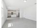 Open concept living room features tile flooring and lots of natural light at 312 Castle Dr, Lake Alfred, FL 33850